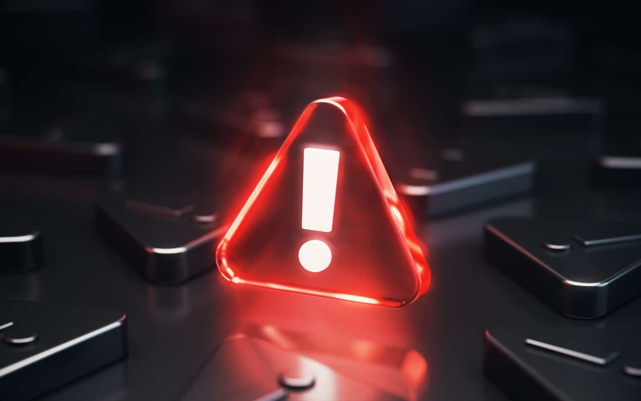Red Glass Warning Sign Symbol Glowing on a Black Background
